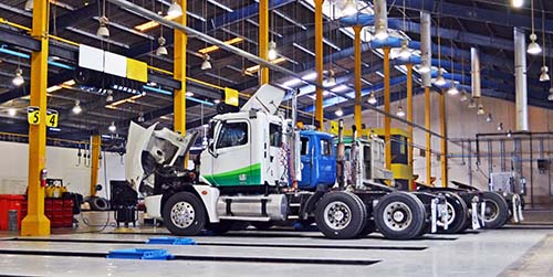 Automotive end-of-line testing, as represented by this image of semi-truck cabs, is faster and more efficient with FleetScore’s brake testing solutions.